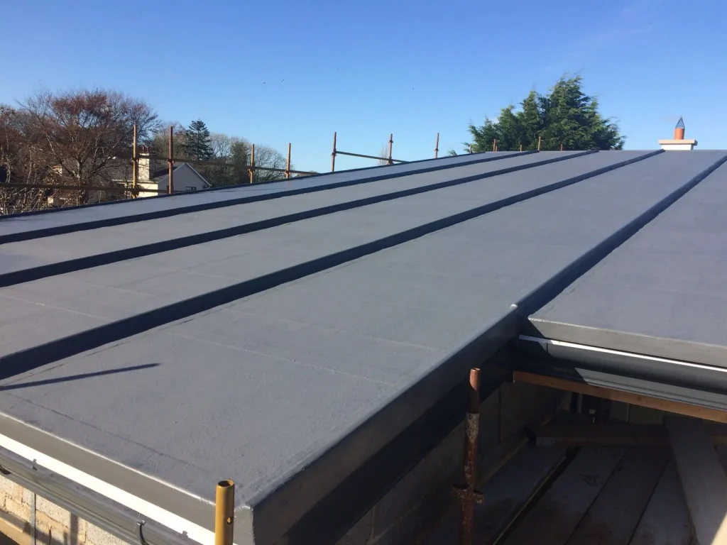 Arboflex GRP overlay roofing kit installation using expansion trims to mimic metal roofing installation